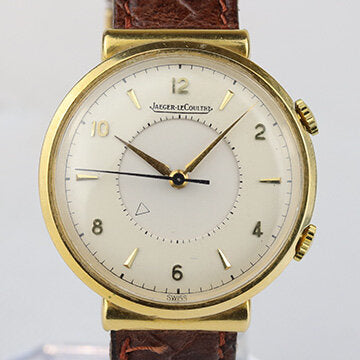 Jaeger LeCoultre Memovox Alarm Vintage 18ct Yellow Gold 35mm Manual Watch; on a brown leather strap, Circa 1950s-1960s