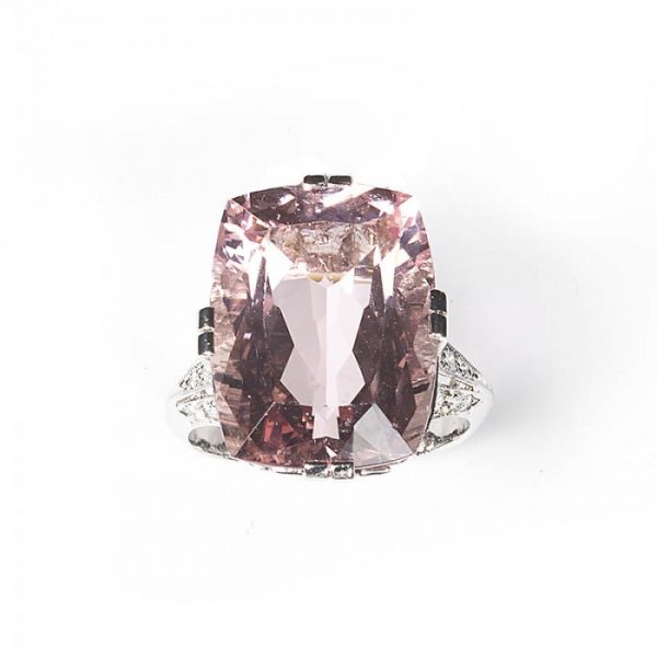 Art Deco Style Pink Kunzite, Diamond and Platinum Dress Ring; featuring a modern 16.50 carat cushion-cut pink kunzite accented by round brilliant-cut diamonds set gallery and shoulders totalling 2.00 carats