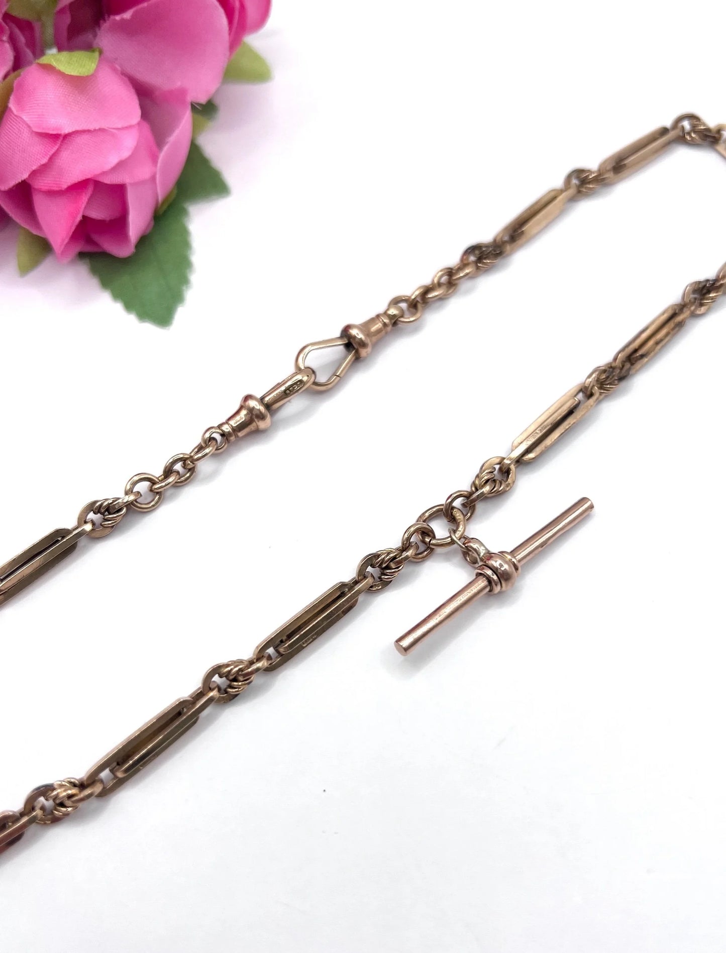 A rose gold fancy link Albert chain necklace