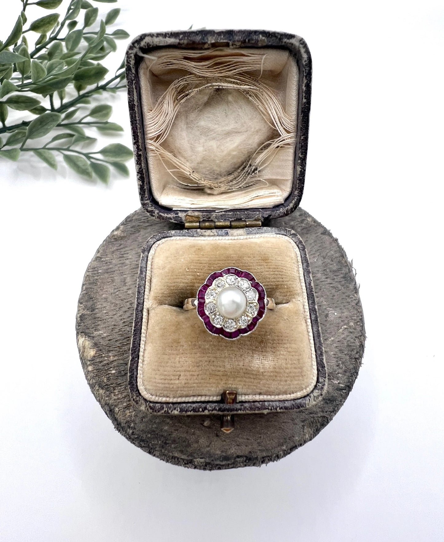 A pearl, diamond and ruby fancy cluster ring in platinum and yellow gold, in a ring box