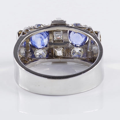 Art Deco 1.60ct Ceylon Sapphire and Old Cut Diamond Two Stone Tank Ring, two Ceylon sapphires with beautiful cornflower blue hue surrounded by old mine-cut diamonds with central raised section of square and rectangular step-cut diamonds in platinum. Circa 1925