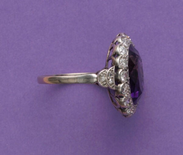 Art Deco Amethyst and Diamond Oval Cluster Ring; large oval faceted amethyst surrounded by 0.50cts old-cut diamonds, pierced white gold mount