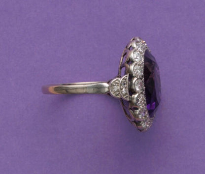 Art Deco Amethyst and Diamond Oval Cluster Ring; large oval faceted amethyst surrounded by 0.50cts old-cut diamonds, pierced white gold mount