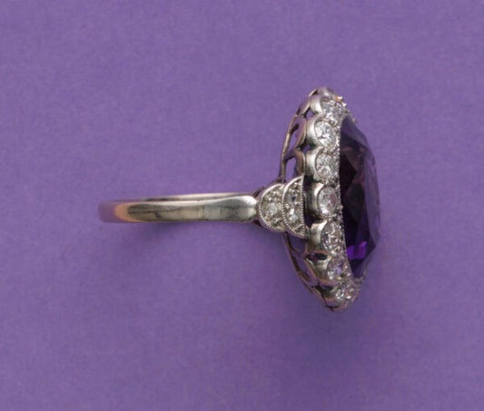 Art Deco Amethyst and Diamond Oval Cluster Ring; large oval faceted amethyst surrounded by 0.50cts old-cut diamonds, pierced white gold mount