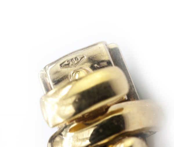 Vintage 7ct Diamond and Ruby Cluster Bracelet; set with 7.00 carats of diamonds and 3.00 carats of rubies in intricate and unique floral clusters surrounded by gold leaves, in 18ct yellow gold, Circa 1930s