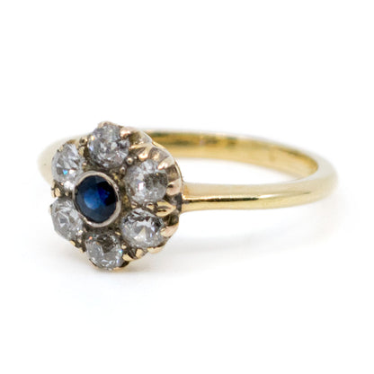 A sapphire and diamond cluster ring in yellow gold