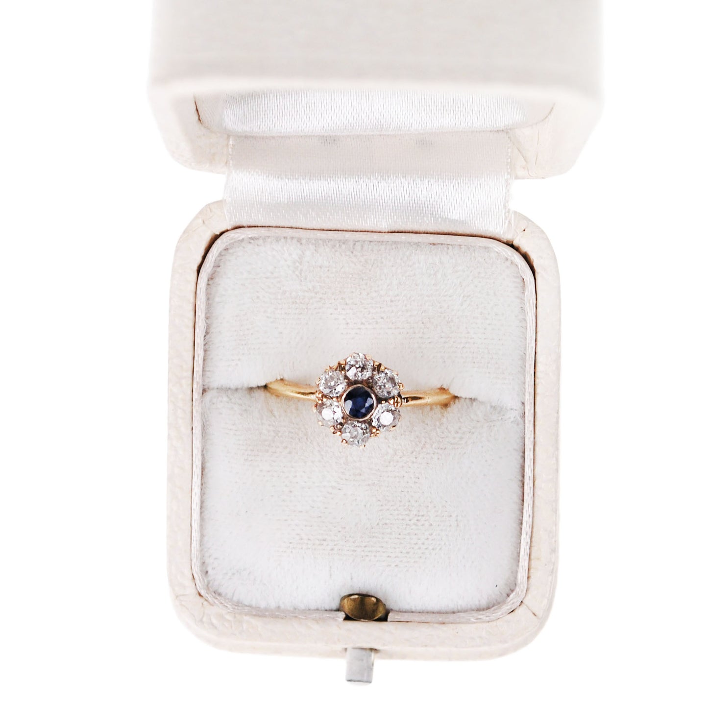 A sapphire and diamond cluster ring in yellow gold, in a ring box