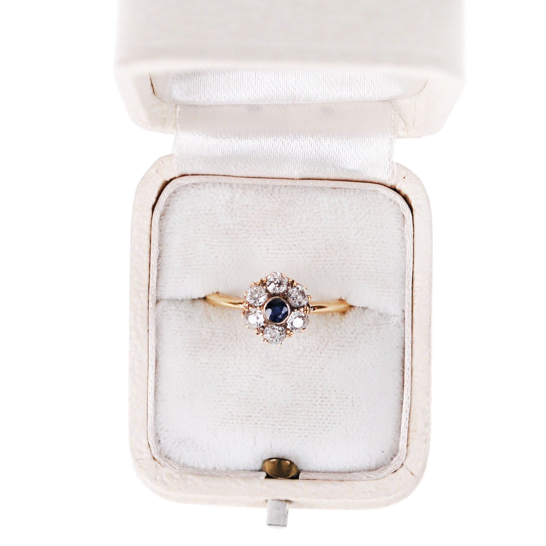 A sapphire and diamond cluster ring in yellow gold, in a ring box