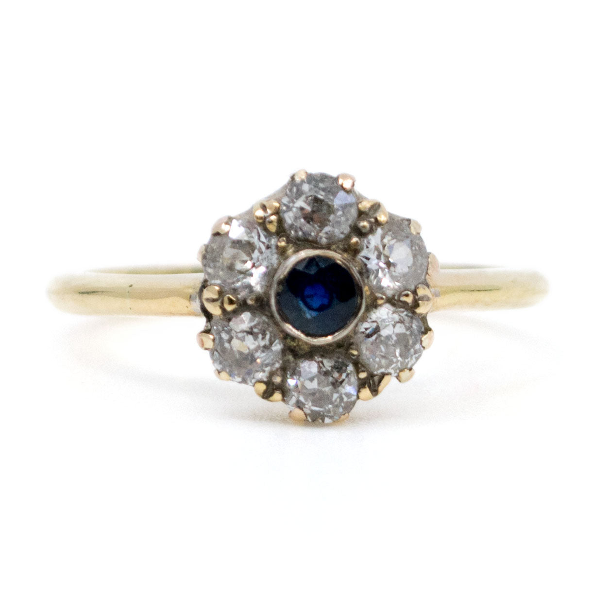 A sapphire and diamond cluster ring in yellow gold