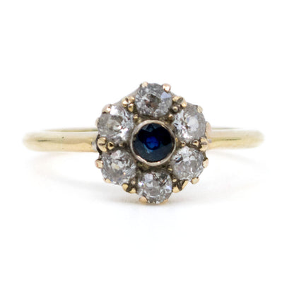 A sapphire and diamond cluster ring in yellow gold