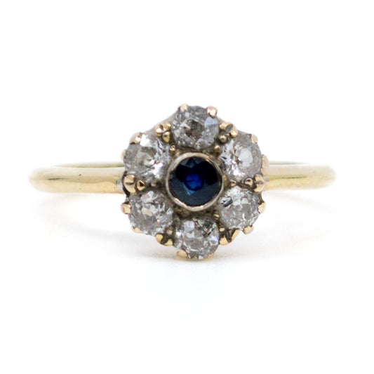 A sapphire and diamond cluster ring in yellow gold