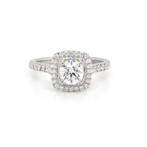 Diamond Cluster Ring in Platinum with GIA Certificate; 0.70 carat brilliant cut diamond set within a surround of diamonds, to diamond-set shoulders, with GIA certificate