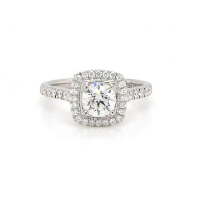 Diamond Cluster Ring in Platinum with GIA Certificate; 0.70 carat brilliant cut diamond set within a surround of diamonds, to diamond-set shoulders, with GIA certificate