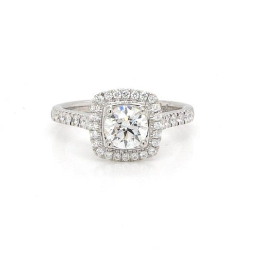 Diamond Cluster Ring in Platinum with GIA Certificate; 0.70 carat brilliant cut diamond set within a surround of diamonds, to diamond-set shoulders, with GIA certificate