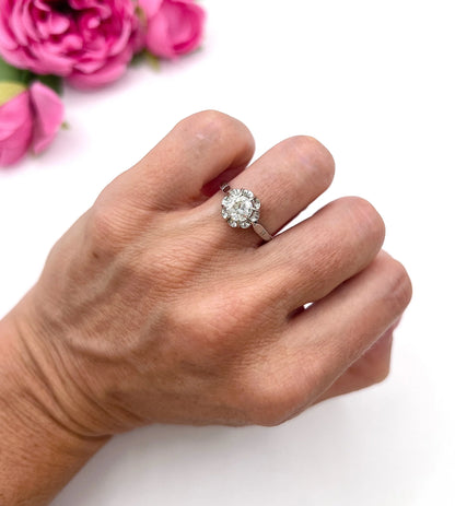 A solitaire diamond ring in platinum, modelled on a hand