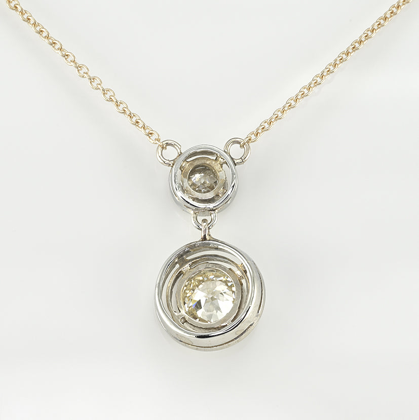 Art Deco 1.15ct Twin Old Cut Diamond Solitaire Target Pendant, 0.85ct old European-cut diamond topped with 0.30ct old mine-cut diamond in 18ct white gold target settings to fixed 18ct yellow gold trace chain