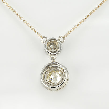 Art Deco 1.15ct Twin Old Cut Diamond Solitaire Target Pendant, 0.85ct old European-cut diamond topped with 0.30ct old mine-cut diamond in 18ct white gold target settings to fixed 18ct yellow gold trace chain