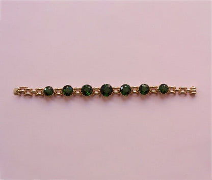 Vintage 24ct Green Tourmaline and Rose Gold Bracelet; link bracelet set with large brilliant cut tourmalines, claw-set in an open setting, USA, Circa 1950
