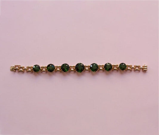 Vintage 24ct Green Tourmaline and Rose Gold Bracelet; link bracelet set with large brilliant cut tourmalines, claw-set in an open setting, USA, Circa 1950