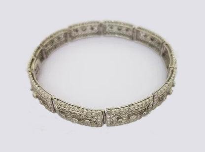 Art Deco Diamond and Platinum Filigree Panel Bracelet; Art Deco diamond filigree panel bracelet set with brilliant cut diamonds. Tests as platinum.