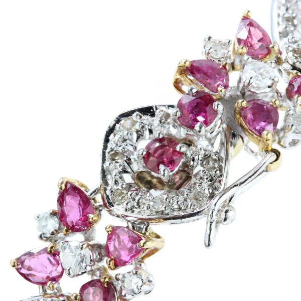 Vintage Thai Ruby and Diamond Bracelet; comprised of 3.52cts mixed-cut Thai rubies and 2.61cts brilliant-cut diamonds in alternating clusters set in 18ct yellow and white gold, Circa 1970s, with GCS certificate