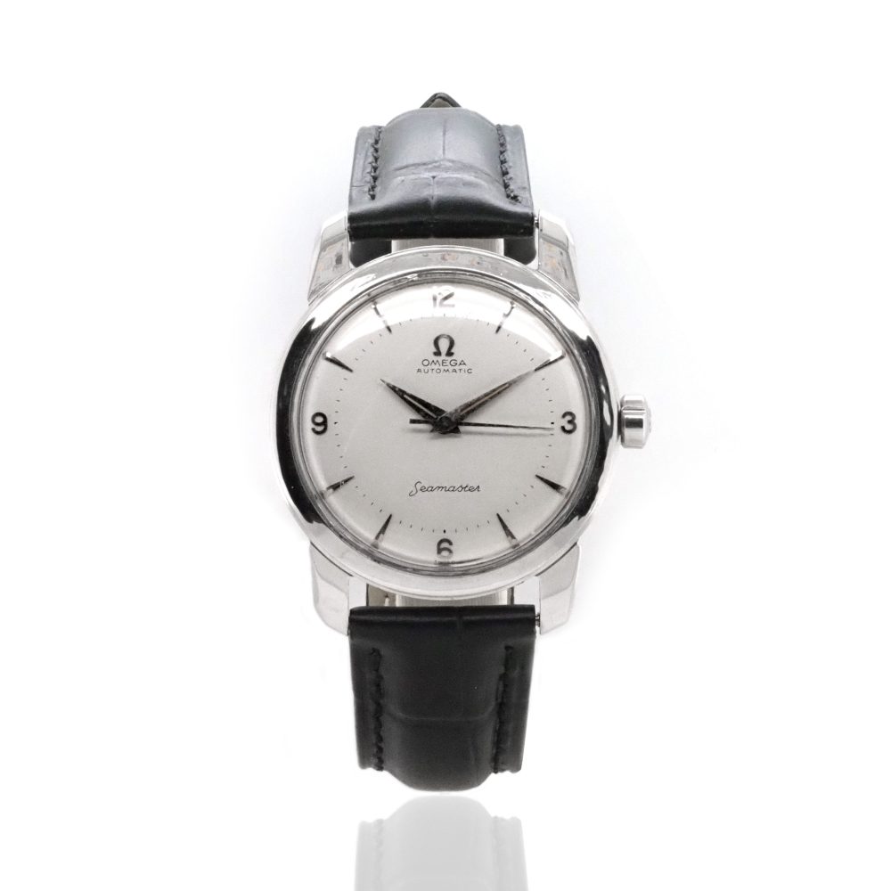 Vintage Omega Seamaster Stainless Steel Automatic Watch, Circa 1956, cream white dial, baton hour markers with numerals every 3 hours, dauphine hands, black leather strap