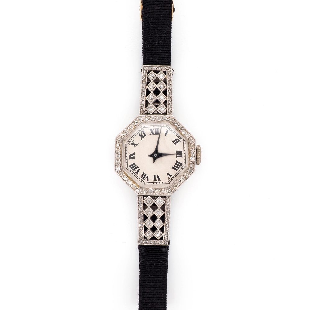 Art Deco Diamond Platinum Quartz Cocktail Watch, Circa 1920, octagonal platinum case features sparkling diamonds set around the bezel and on the top and bottom attachments