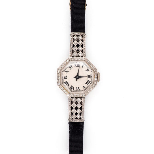 Art Deco Diamond Platinum Quartz Cocktail Watch, Circa 1920, octagonal platinum case features sparkling diamonds set around the bezel and on the top and bottom attachments