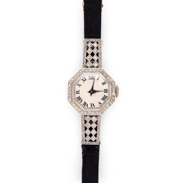 Art Deco Diamond Platinum Quartz Cocktail Watch, Circa 1920, octagonal platinum case features sparkling diamonds set around the bezel and on the top and bottom attachments