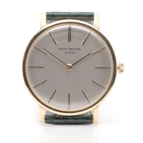 Vintage Patek Philippe Calatrava 18ct Gold 3426 Manual Wind Watch, 18ct yellow gold case with white dial and baton hour markers on a green leather strap. Circa 1962
