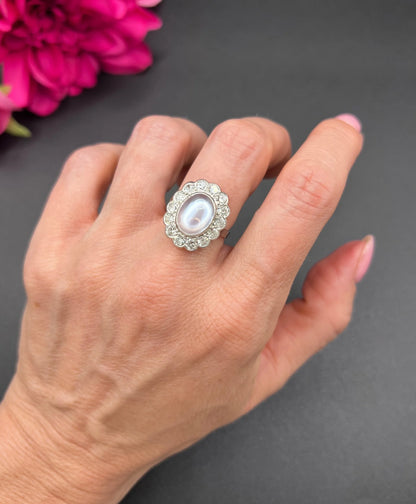 Antique French Platinum Cabochon Moonstone and Diamond Cluster Ring, Circa 1920