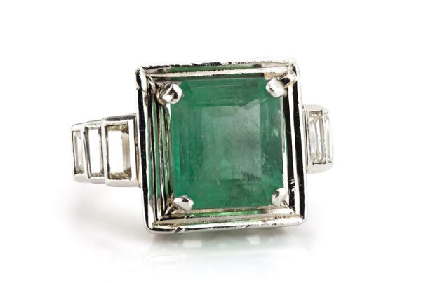 4.20ct Natural Colombian Emerald and Baguette Diamond Ring; natural 4.20 carat octagonal-cut Colombian emerald flanked by 0.70cts baguette cut diamond set shoulders, with GCS Certificate
