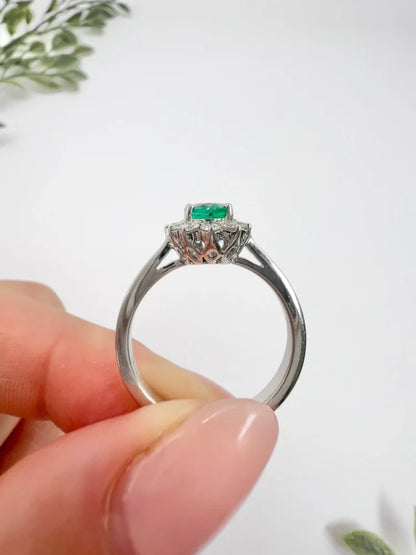 Emerald And Diamond Cluster Ring In 18 Carat White Gold