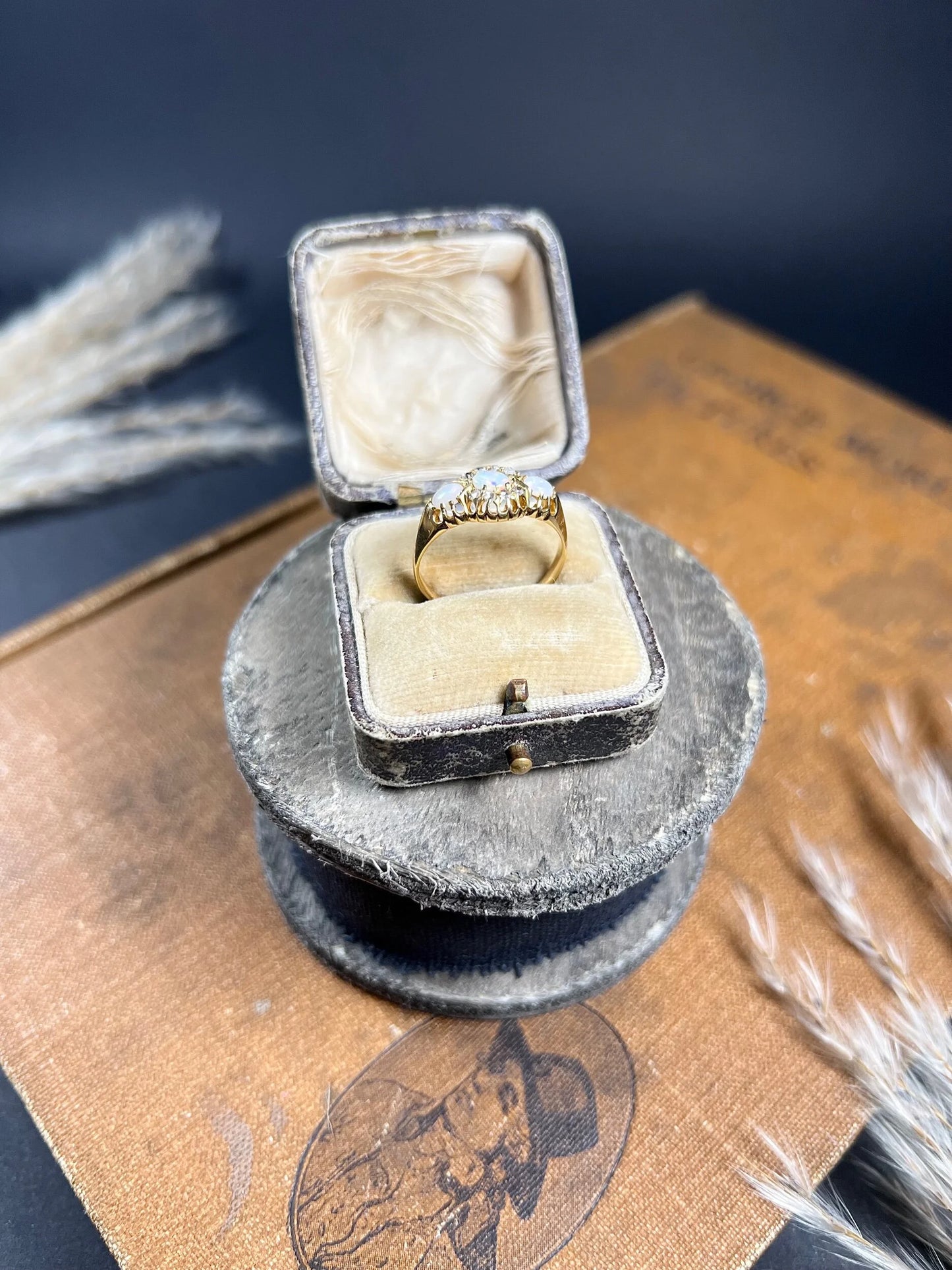 A yellow gold opal and diamond dress ring, in a ring box