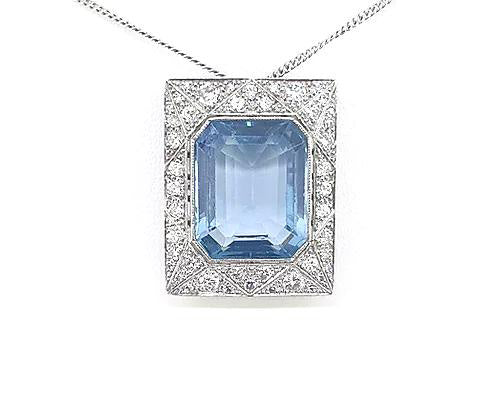 Art Deco Style Asscher Cut Aquamarine and Diamond Pendant; a striking octagonal step-cut aquamarine is surrounded by a diamond-set 18ct white gold mount.