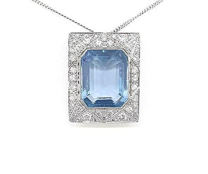 Art Deco Style Asscher Cut Aquamarine and Diamond Pendant; a striking octagonal step-cut aquamarine is surrounded by a diamond-set 18ct white gold mount.