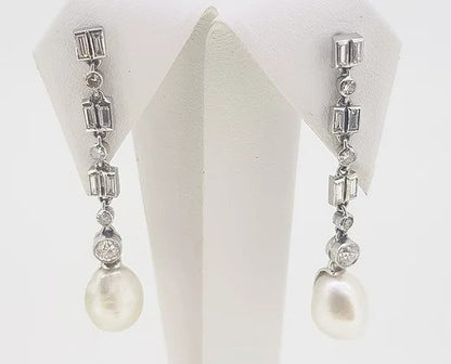 Natural Pearl and Diamond Drop Earrings; natural saltwater pearls suspended from mixed-cut diamond set drops, 18ct gold. With certificate
