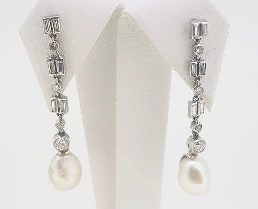 Natural Pearl and Diamond Drop Earrings; natural saltwater pearls suspended from mixed-cut diamond set drops, 18ct gold. With certificate