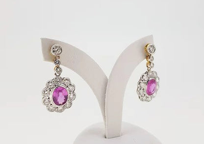 Pink Sapphire and Diamond Oval Cluster Drop Earrings; featuring 2.70cts oval faceted pink sapphires surrounded by 2.51cts diamonds, 18ct gold