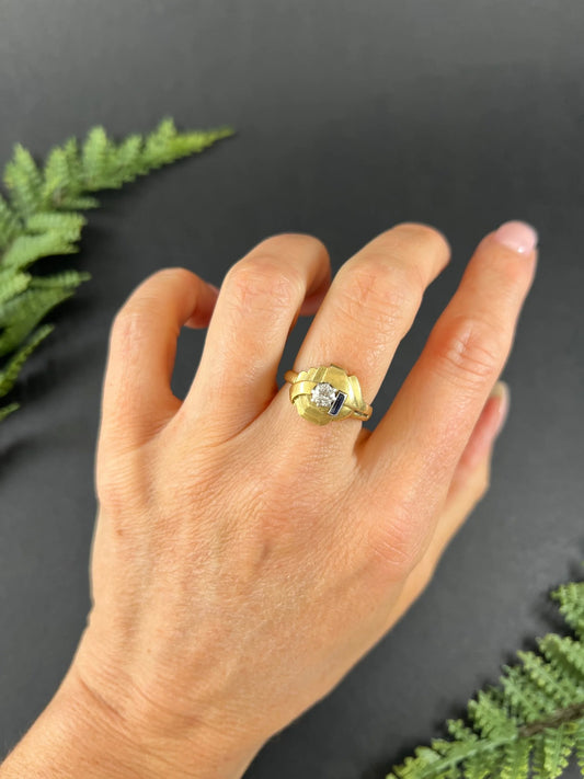 A yellow gold diamond and sapphire cocktail ring, modelled on a hand