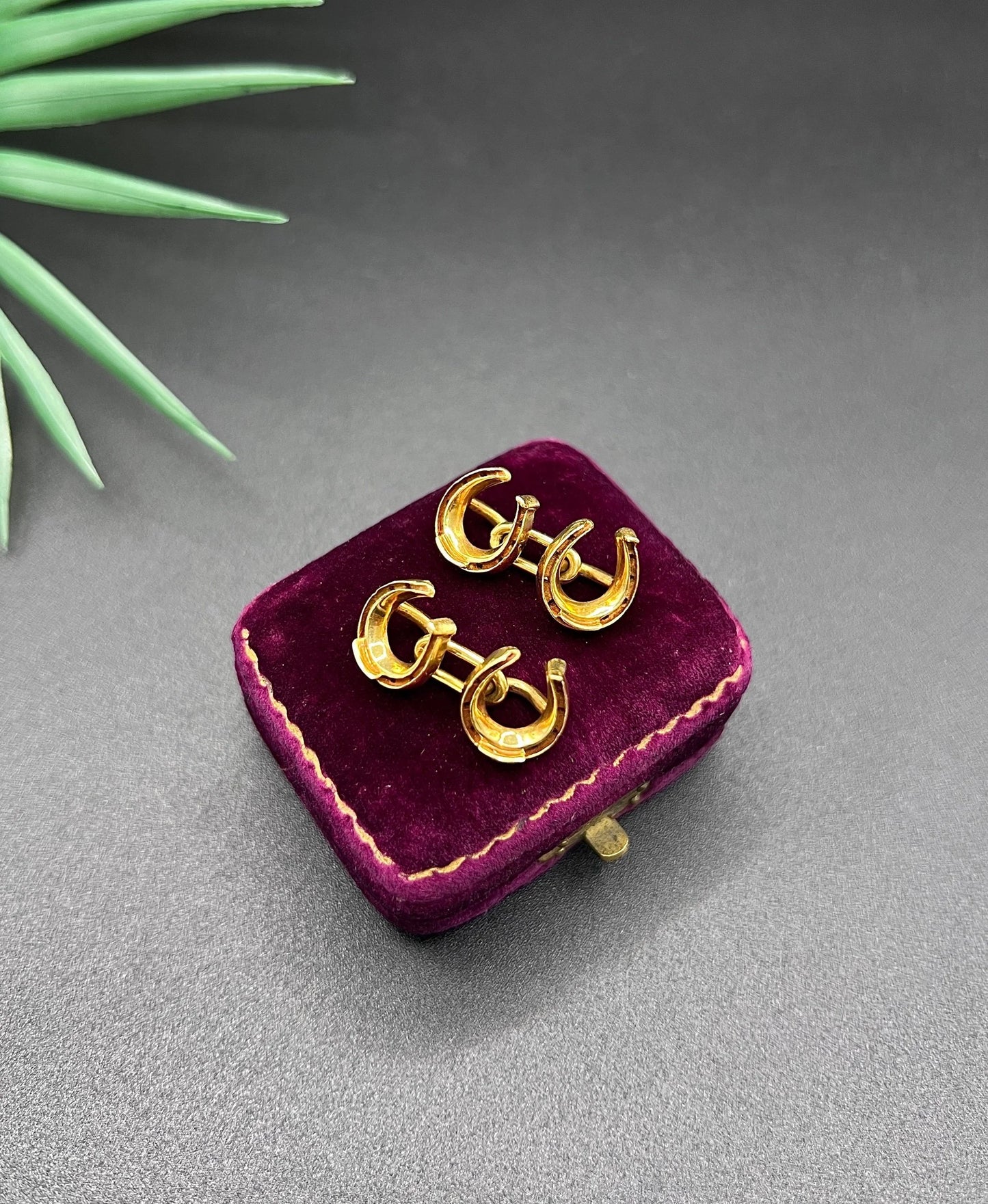 A pair of double-sided horseshoe cufflinks in yellow gold