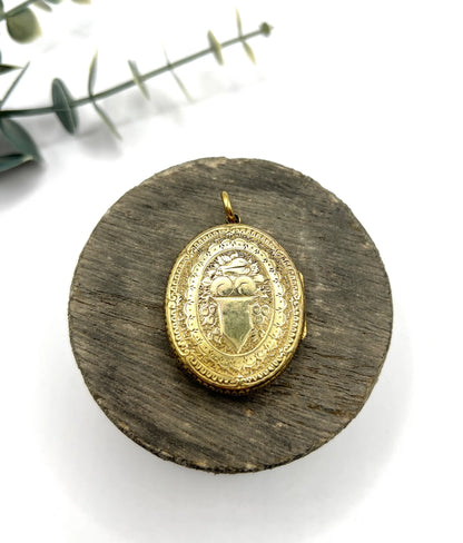 Early Victorian 15 Carat Yellow Gold Floral Engraved Oval Shaped Locket, Circa 1860