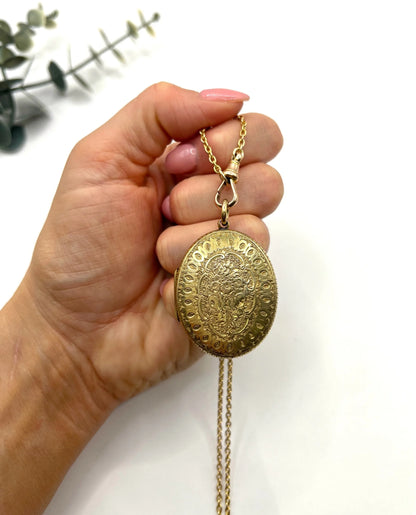 Early Victorian 15 Carat Yellow Gold Floral Engraved Oval Shaped Locket, Circa 1860
