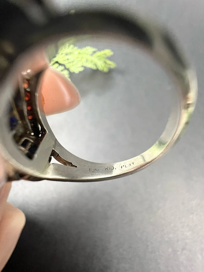 A close-up of a stamp inside a platinum ring shank