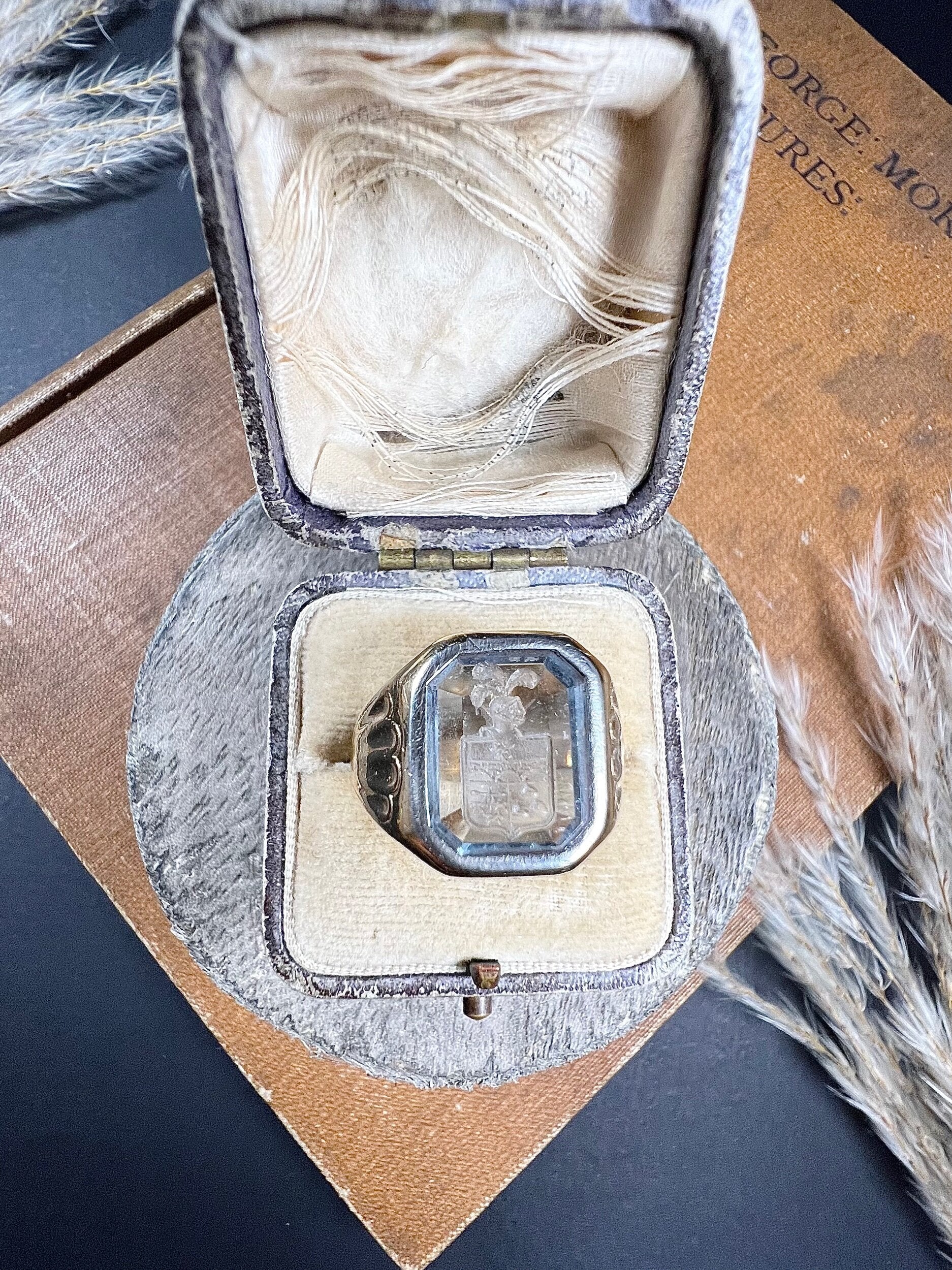 A yellow gold blue glass intaglio signet ring, in a ring box