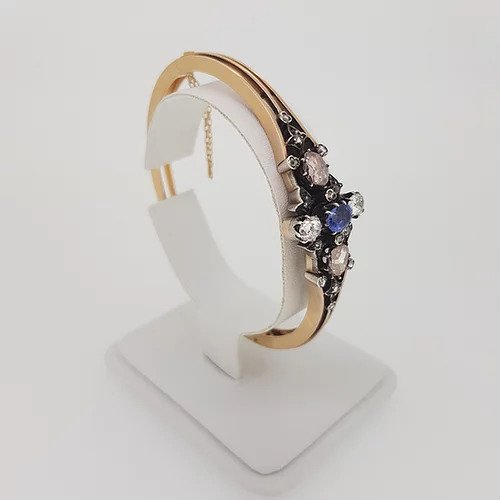 Antique Victorian Natural Sapphire and Old Cut Diamond Bangle Bracelet; central oval faceted natural sapphire surrounded by two white old-cut diamonds and two foiled pink rose-cut diamonds