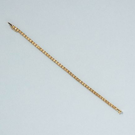 5ct Diamond Line Tennis Bracelet in 18ct Yellow Gold, 50 round brilliant-cut diamonds totalling 5 carats in individual articulated square settings