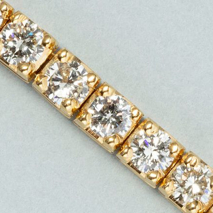 5ct Diamond Line Tennis Bracelet in 18ct Yellow Gold, 50 round brilliant-cut diamonds totalling 5 carats in individual articulated square settings