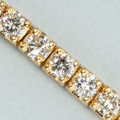 5ct Diamond Line Tennis Bracelet in 18ct Yellow Gold, 50 round brilliant-cut diamonds totalling 5 carats in individual articulated square settings