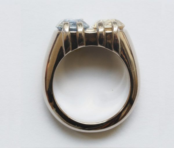 Blue and Yellow Cushion Cut Sapphire and 18ct Grey Gold Heavy Dress Ring; set with a 2.80ct light blue sapphire and 2.73ct yellow sapphire